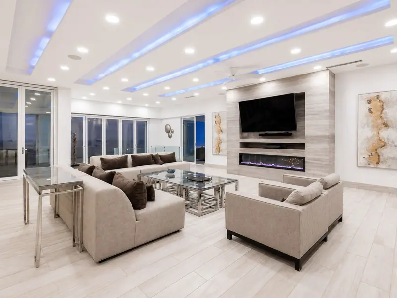 Villa Lands End living room with TV, fireplace, and ocean sliders