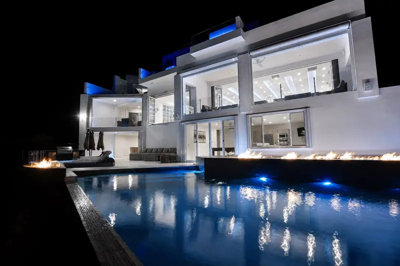 Villa Lands End night pool with linear fire feature